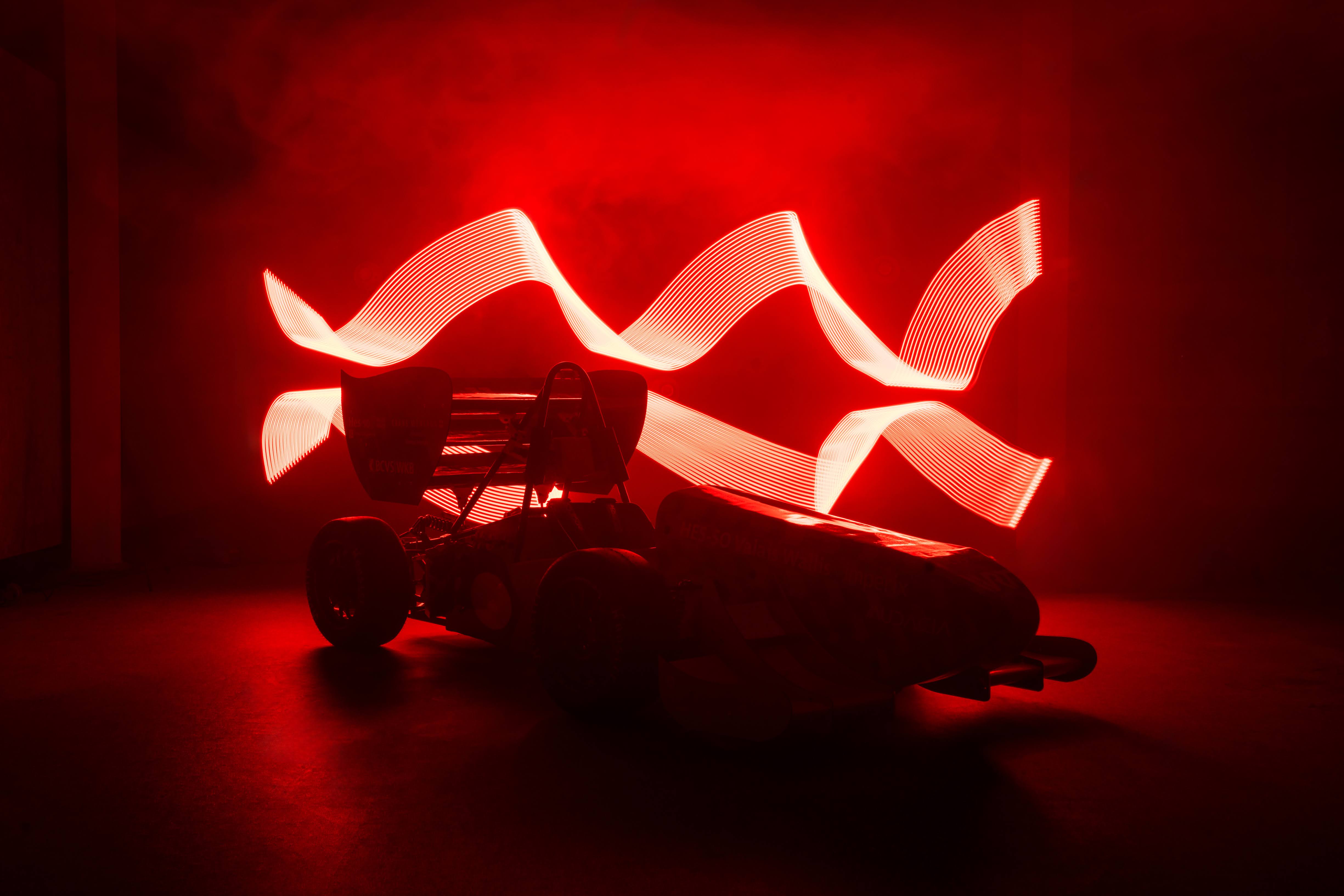 The VRT single-seater in a dramatic red light-painted long exposure.